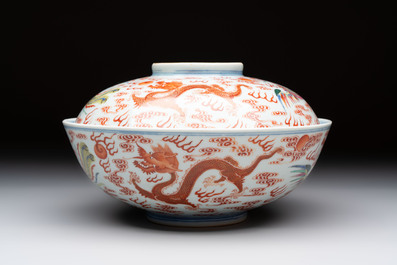 A Chinese famille rose 'dragon and phoenix' bowl and cover, Jiaqing mark and of the period