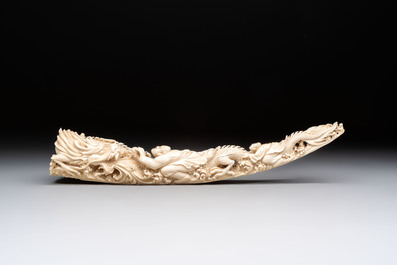 A Chinese ivory carving depicting a Luohan and a dragon, 'Da Ming 大明' mark, 19/20th C.