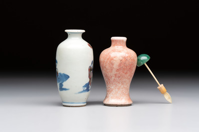 A Chinese peachbloom-crackle-glazed 'meiping' snuff bottle and a figural blue, white and copper-red snuff bottle, Yongzheng mark, 19th C.