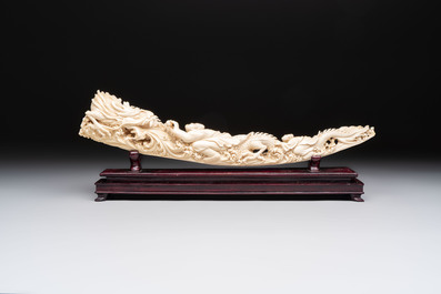 A Chinese ivory carving depicting a Luohan and a dragon, 'Da Ming 大明' mark, 19/20th C.