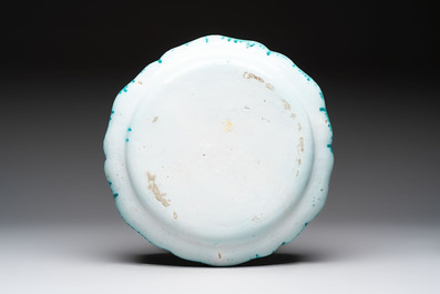 A large polychrome Brussels faience bowl and stand with butterfly and peacock design, 18th C.