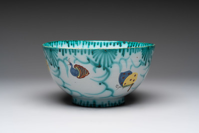 A large polychrome Brussels faience bowl and stand with butterfly and peacock design, 18th C.