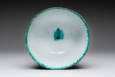 A large polychrome Brussels faience bowl and stand with butterfly and peacock design, 18th C.
