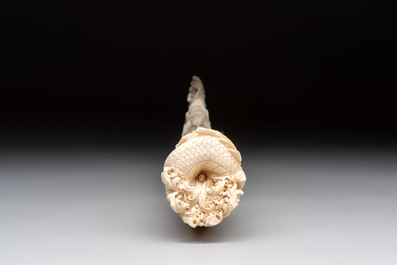 A Chinese ivory carving depicting a Luohan and a dragon, 'Da Ming 大明' mark, 19/20th C.