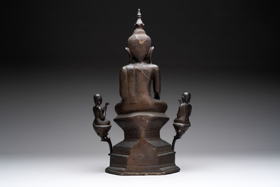 A large and fine Burmese bronze Buddha with two servants, 16/17th C.