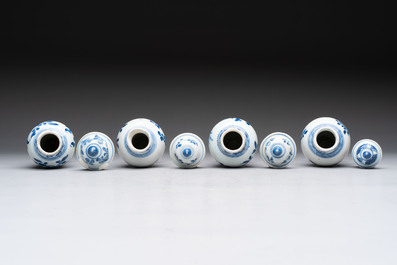 A varied collection of eight Chinese blue and white vases, two teapots and two loving cups, Kangxi/Qianlong