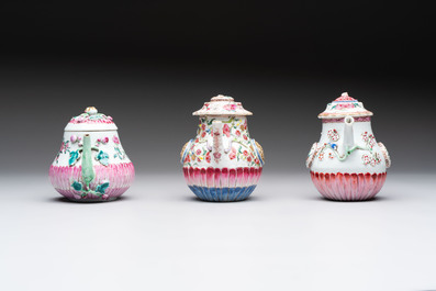 A group of five Chinese famille rose teapots and covers and three stands, Yongzheng/Qianlong