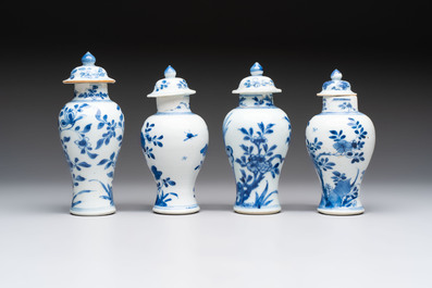 A varied collection of eight Chinese blue and white vases, two teapots and two loving cups, Kangxi/Qianlong