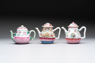 A group of five Chinese famille rose teapots and covers and three stands, Yongzheng/Qianlong