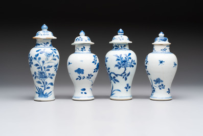 A varied collection of eight Chinese blue and white vases, two teapots and two loving cups, Kangxi/Qianlong