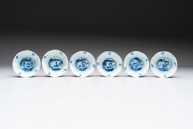 A set of 11 Chinese blue and white cups and saucers with riverscape design, Kangxi