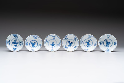 A set of six Chinese blue and white cups and saucers with floral design, Kangxi