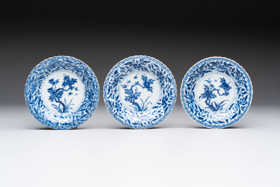 A set of six Chinese blue and white cups and saucers with floral design, Kangxi