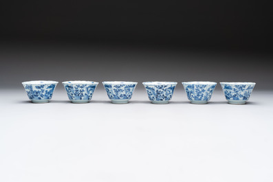 A set of 11 Chinese blue and white cups and saucers with riverscape design, Kangxi