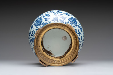 A gilt-bronze-mounted Chinese blue and white bottle vase with floral design, 19/20th C.