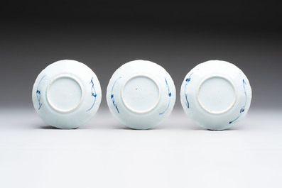 A set of 11 Chinese blue and white cups and saucers with riverscape design, Kangxi