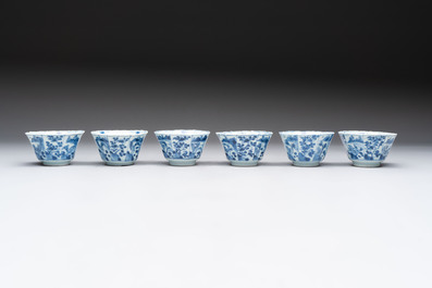 A set of 11 Chinese blue and white cups and saucers with riverscape design, Kangxi