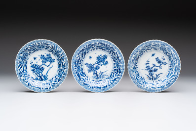 A set of six Chinese blue and white cups and saucers with floral design, Kangxi