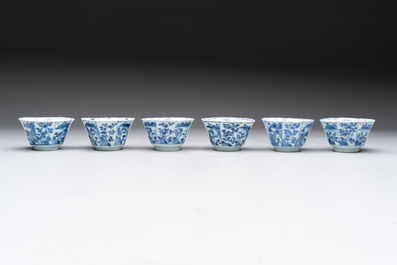 A set of 11 Chinese blue and white cups and saucers with riverscape design, Kangxi