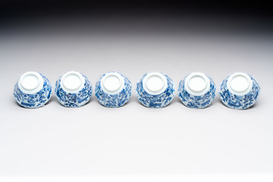 A set of 11 Chinese blue and white cups and saucers with riverscape design, Kangxi