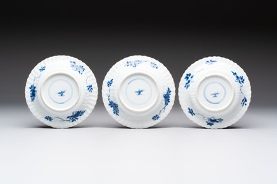 A set of six Chinese blue and white cups and saucers with floral design, Kangxi