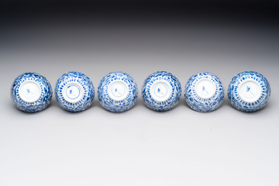A set of six Chinese blue and white cups and saucers with floral design, Kangxi