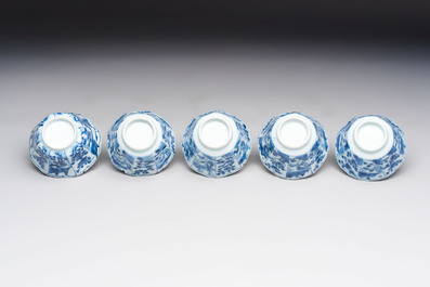 A set of 11 Chinese blue and white cups and saucers with riverscape design, Kangxi