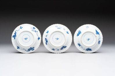 A set of six Chinese blue and white cups and saucers with floral design, Kangxi