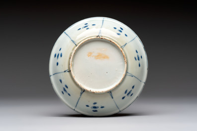 Five Chinese blue and white 'kraak' and 'kraak'-style plates, a saucer and a bowl, Ming/Qing