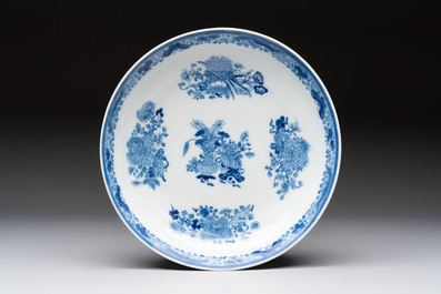 Seven Chinese blue and white plates and dishes with floral design, 18th C.