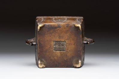 A Chinese archaistic bronze square censer with two handles, Xuande mark, Qing