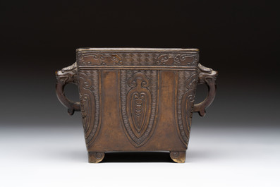 A Chinese archaistic bronze square censer with two handles, Xuande mark, Qing