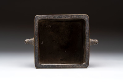 A Chinese archaistic bronze square censer with two handles, Xuande mark, Qing