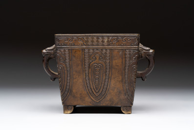 A Chinese archaistic bronze square censer with two handles, Xuande mark, Qing