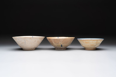 Three Kashan blue and white pierced pottery bowls, Iran, 12/13th C.