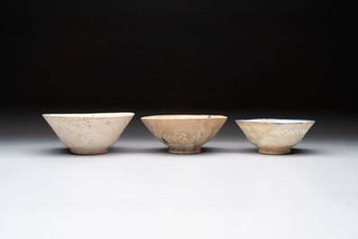 Three Kashan blue and white pierced pottery bowls, Iran, 12/13th C.