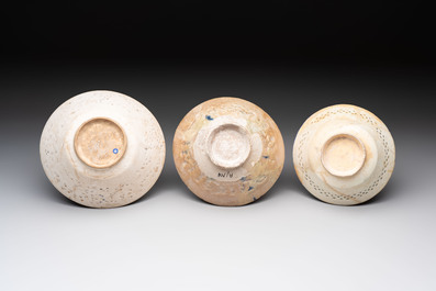 Three Kashan blue and white pierced pottery bowls, Iran, 12/13th C.