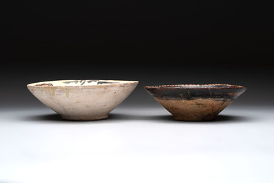 A Samanid pottery 'Kufic' inscribed bowl and a white-spotted brown-ground bowl, Iran, 10th C.