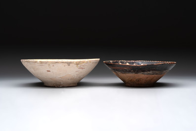 A Samanid pottery 'Kufic' inscribed bowl and a white-spotted brown-ground bowl, Iran, 10th C.