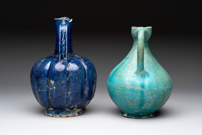 A Kashan turquoise-glazed ewer and a Nishapur blue-glazed ewer, Iran, 12th C.