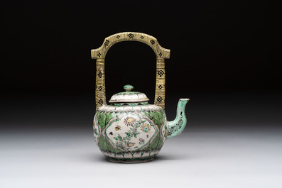 A Chinese verte biscuit teapot and cover with floral design, Kangxi