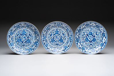 Six Chinese blue and white 'peony scroll' plates, Kangxi