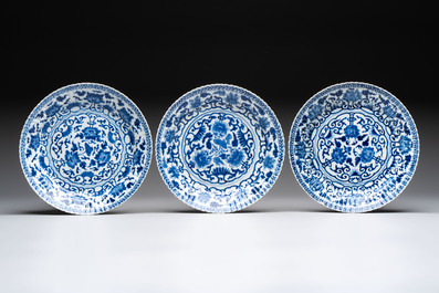 Six Chinese blue and white 'peony scroll' plates, Kangxi