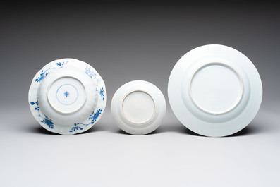 Six Chinese blue and white plates and a dish with landscape design, 18th C.