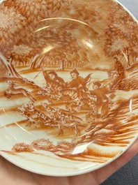 A Chinese iron-red-decorated 'Deer Hunting' cup and saucer, Qianlong