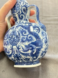 A rare and fine Chinese blue and white double gourd 'dragon' vase with ruyi handles, Qianlong mark and of the period