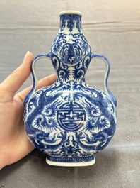 A rare and fine Chinese blue and white double gourd 'dragon' vase with ruyi handles, Qianlong mark and of the period