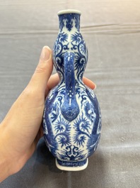 A rare and fine Chinese blue and white double gourd 'dragon' vase with ruyi handles, Qianlong mark and of the period