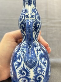 A rare and fine Chinese blue and white double gourd 'dragon' vase with ruyi handles, Qianlong mark and of the period