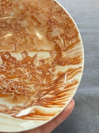 A Chinese iron-red-decorated 'Deer Hunting' cup and saucer, Qianlong